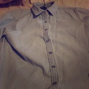 A light blue woman’s button down